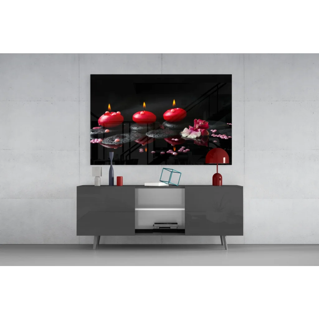 Glowing red candles and pink lotus on dark water glass wall art