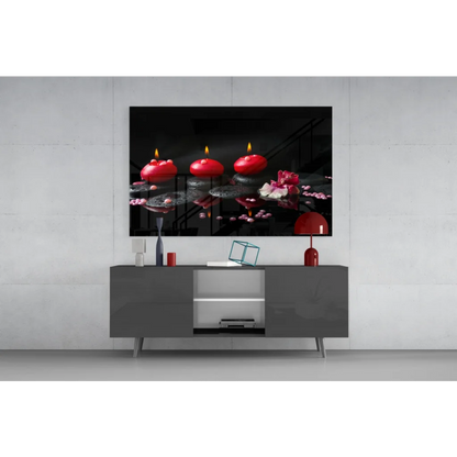 Glowing red candles and pink lotus on dark water glass wall art