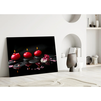 Glowing red candles and pink flowers glass wall art on dark stones