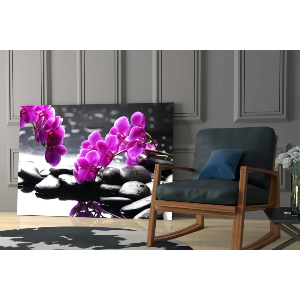 Vibrant purple orchids on black stones in glass wall art print