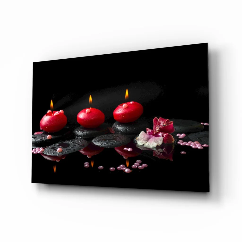 Glowing red candles glass wall art with pink flowers on dark stones