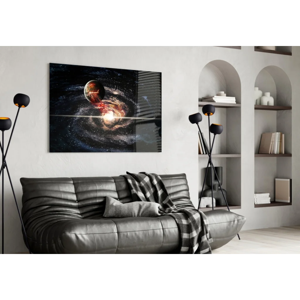 Black leather sofa with quilted texture and plaid throw under cosmic galaxy wall art