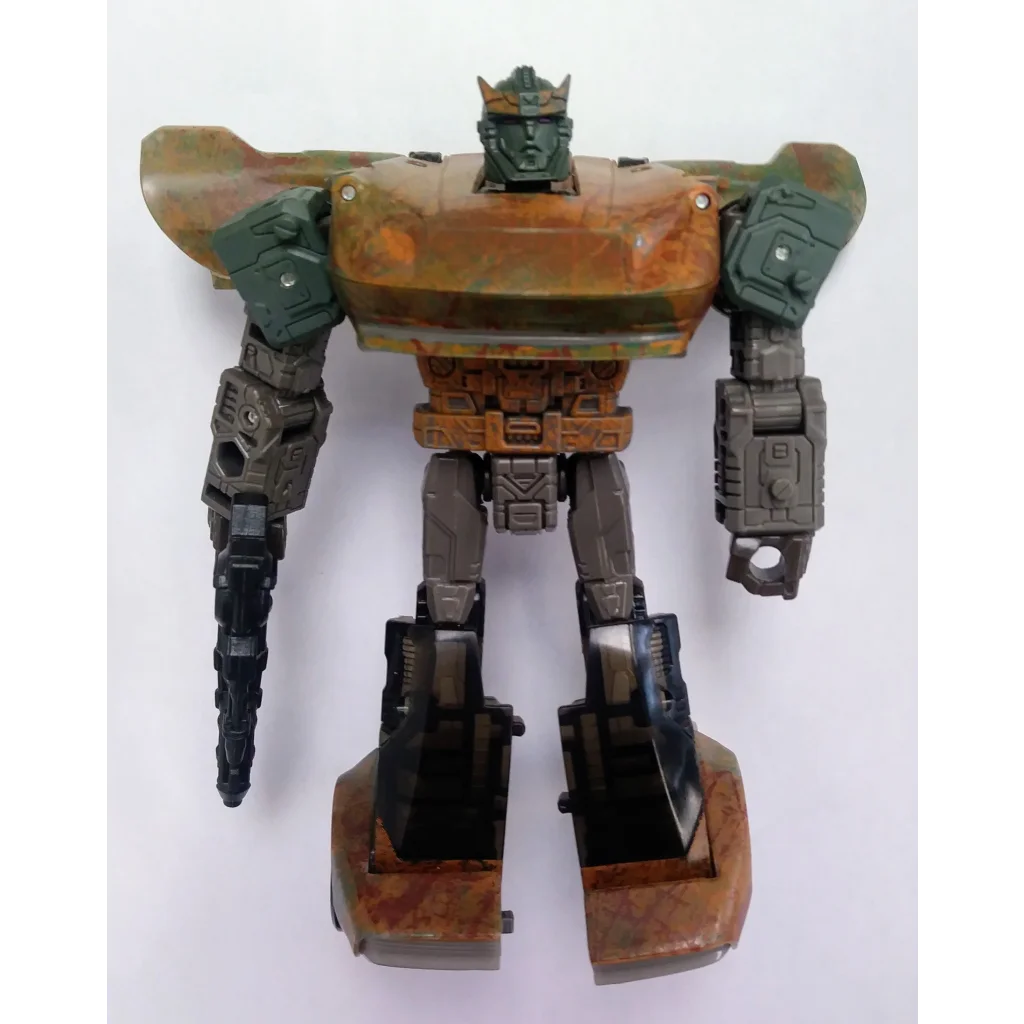Green and brown camo Transformers action figure with black accents from Hasbro G1