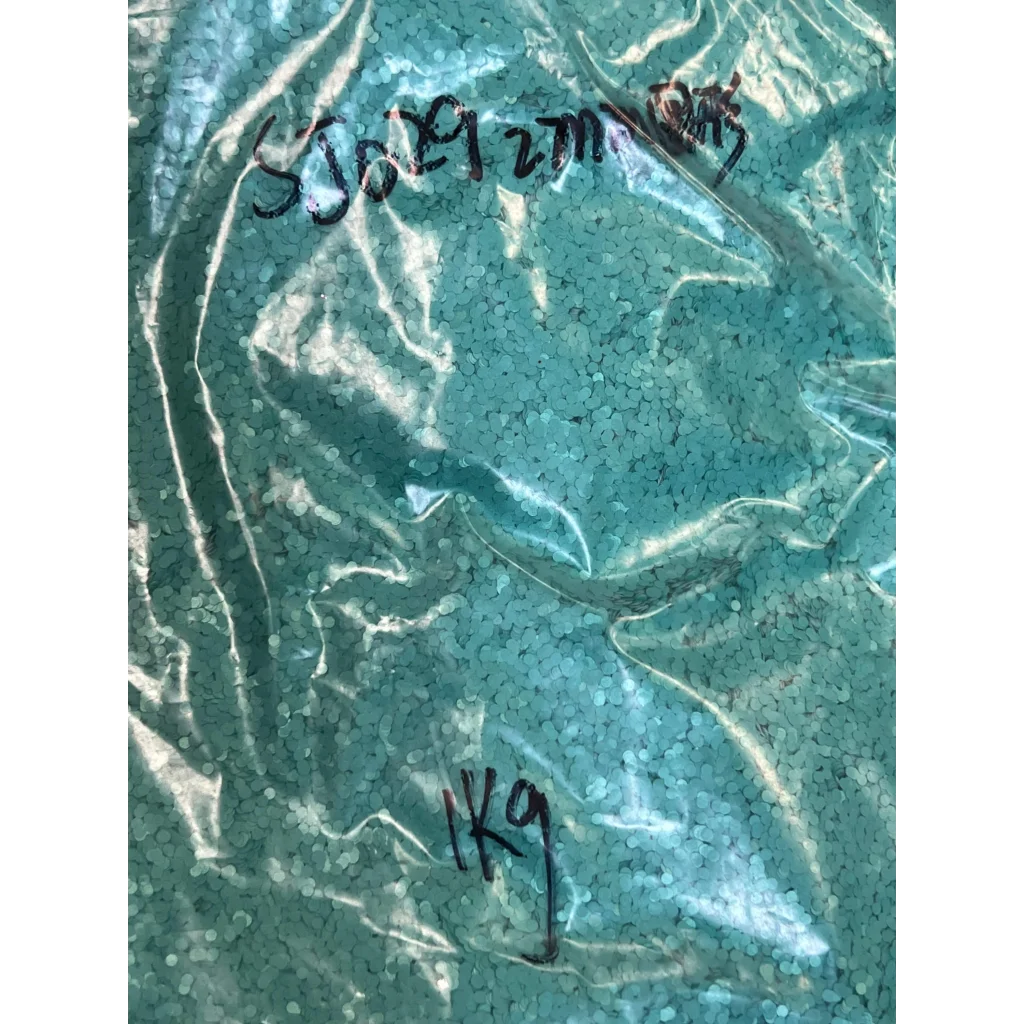 Teal-colored plastic pellets in Sparkly Light Pink F321R Glitter Collection Pink 2mm bag