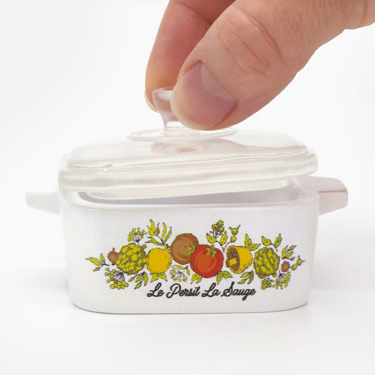 Spice of Life mini casserole trinket box with clear lid on a wooden surface