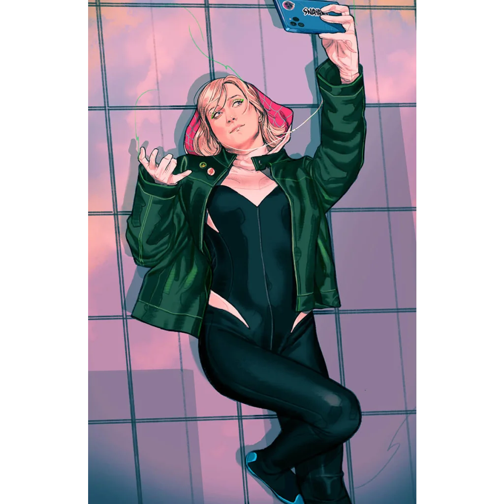 Blonde woman with pink-tipped hair in black bodysuit and dark green jacket taking a selfie with a blue phone
