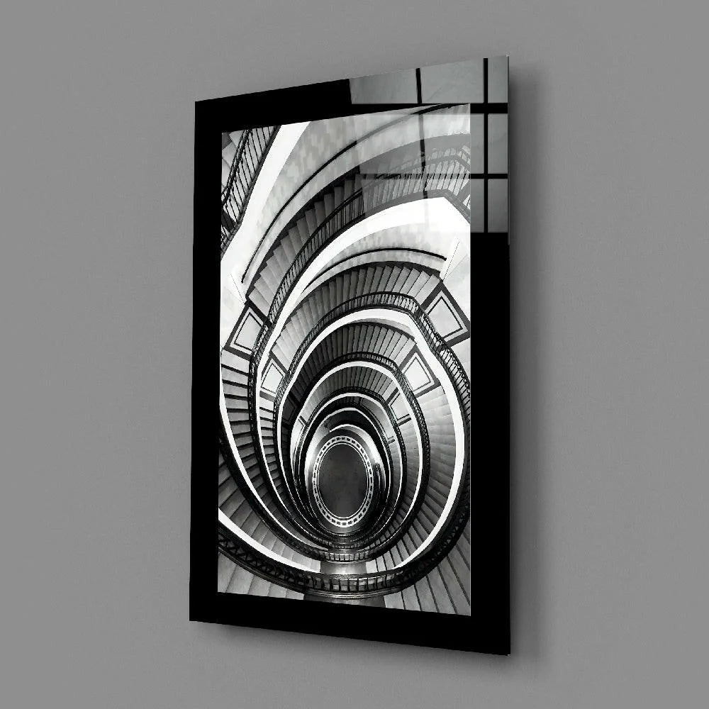 Black-framed B&W photo of spiral staircase glass wall art
