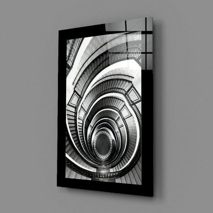 Black-framed B&W photo of spiral staircase glass wall art