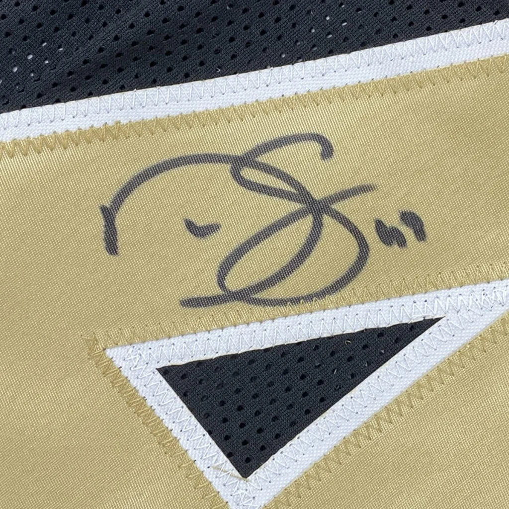 Autographed gold and black custom jersey from a pro sports league, perfect for fans