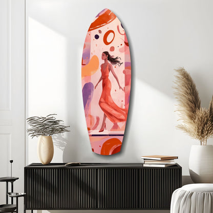Oval glass wall art featuring a woman in red dress among abstract orange and purple shapes, displayed above a black cabinet in a modern interior setting.
