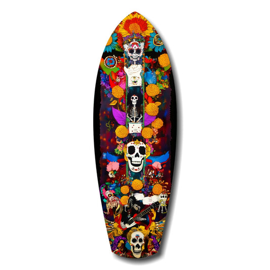 Surfboard-shaped art piece featuring stacked colorful skulls surrounded by vibrant flowers, marigolds, and a skeleton musician on black background.