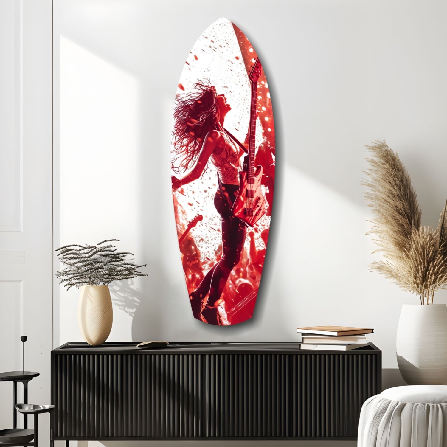 Red and white glass wall art featuring a silhouetted female musician with guitar, displayed above black credenza in minimalist interior setting.