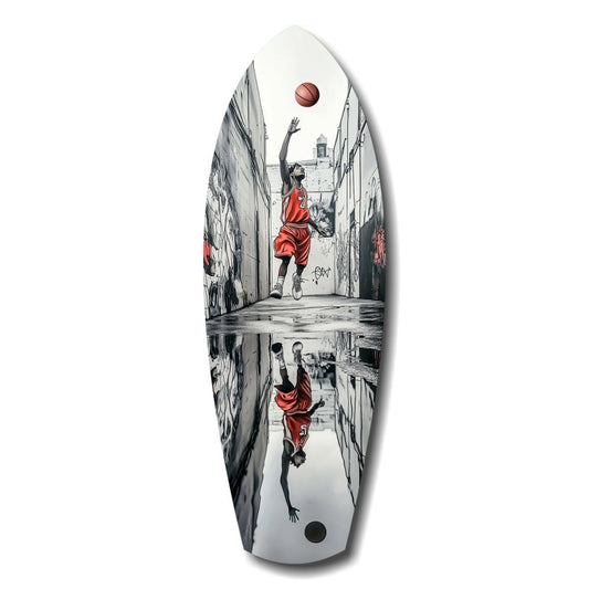 Oval glass wall art depicting a basketball player in red shooting upward in a narrow alleyway, with reflection below.