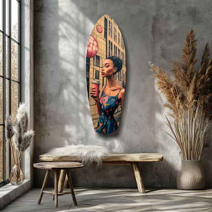 Oval glass wall art depicting a woman in blue dress holding a beverage against urban building backdrop, displayed above wooden bench in minimalist room setting.