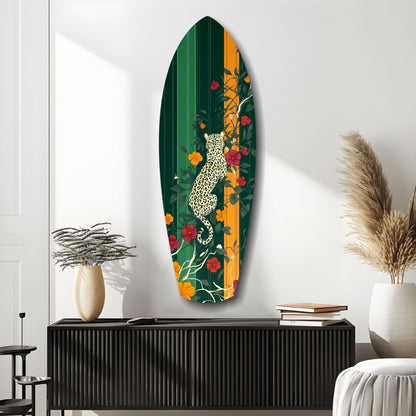 Oval glass wall art featuring white leopard among orange and red flowers on dark green background, displayed above black cabinet in modern interior.