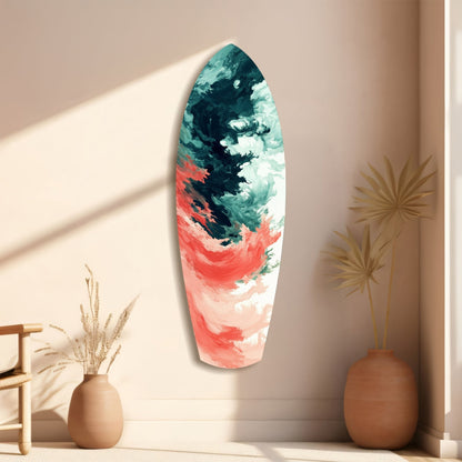 Elongated oval glass wall art with teal, coral, and white painted abstract brushstrokes, displayed on beige wall with ceramic vases.