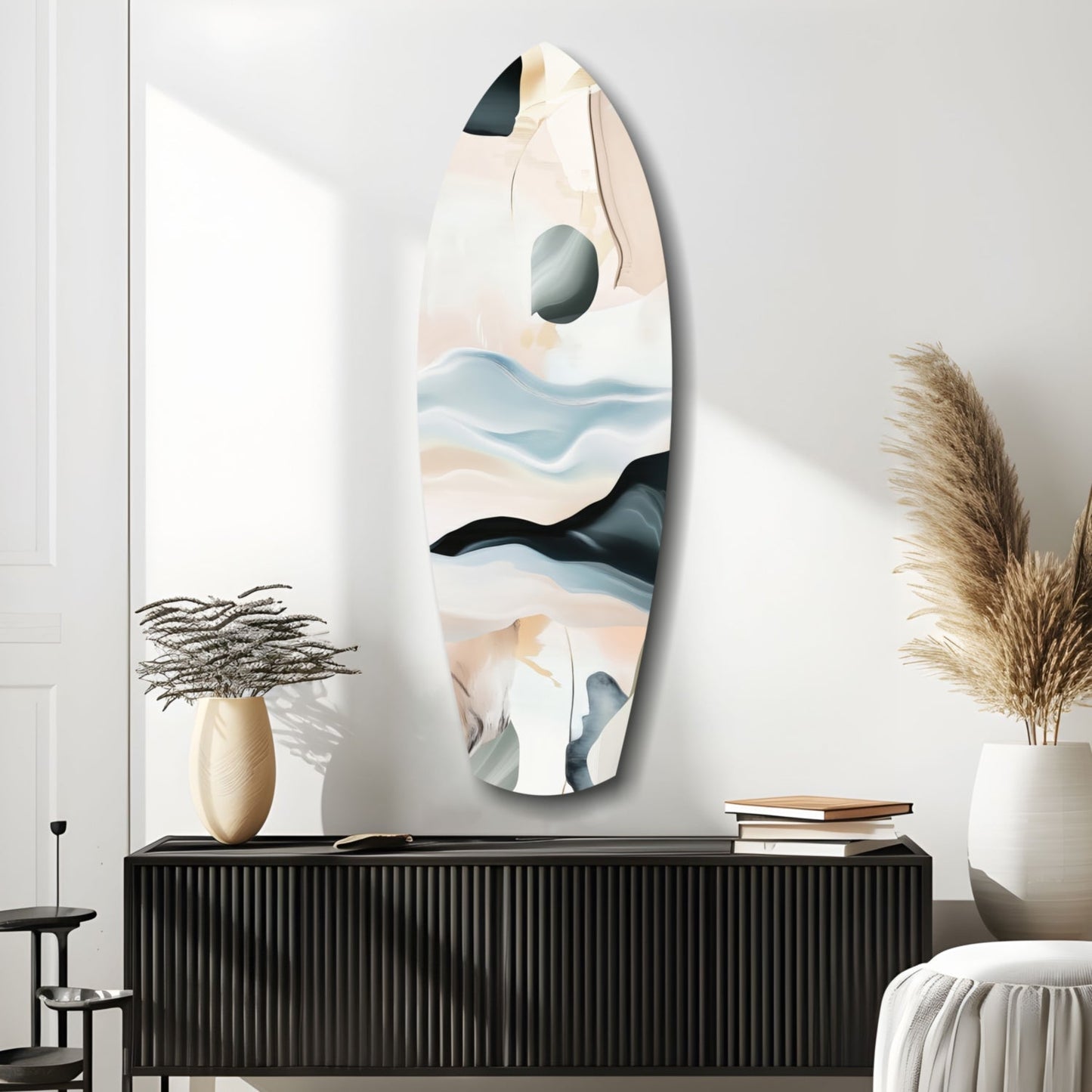 Abstract sailing glass wall art with layered blue, beige, and black waves displayed above black cabinet in styled interior.