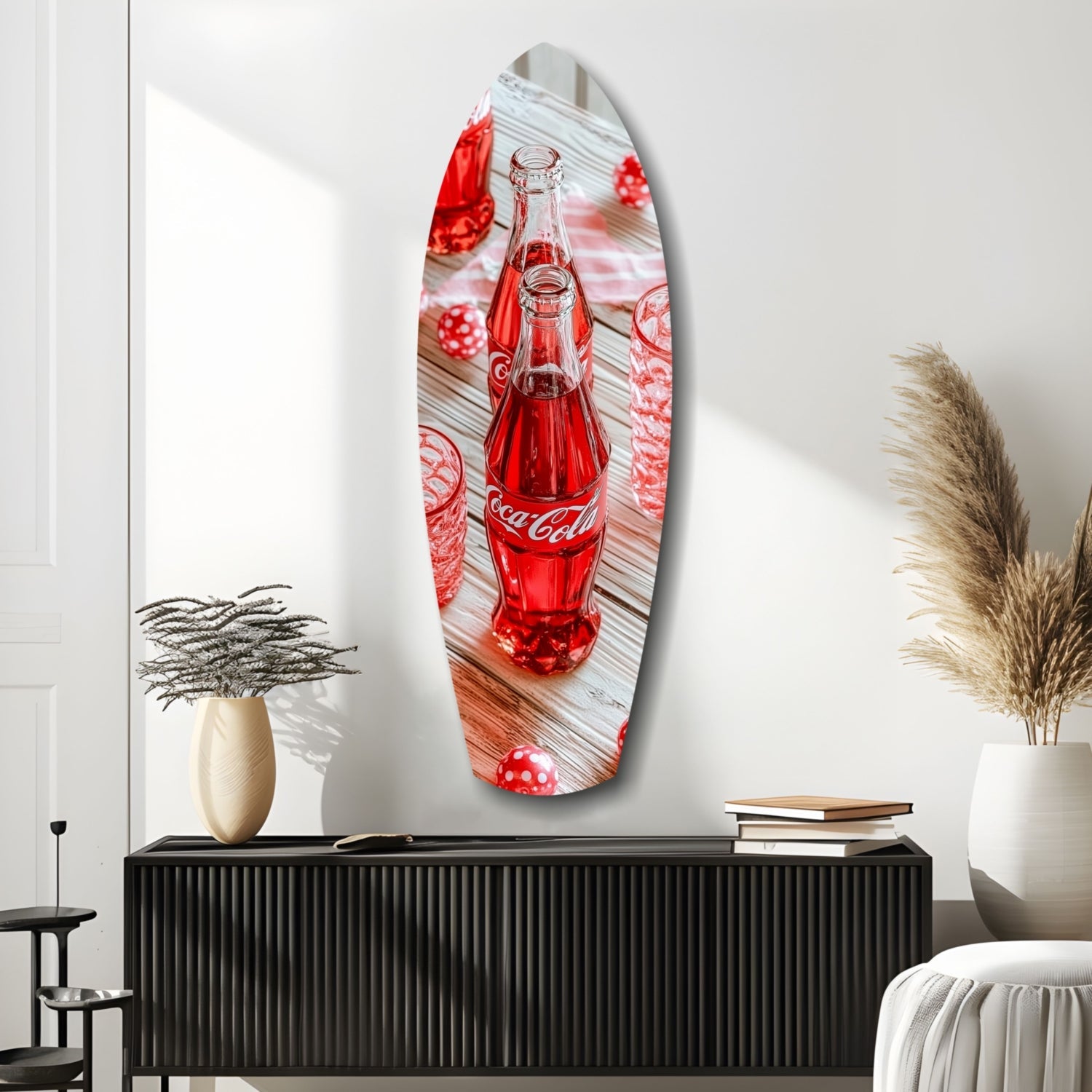 Oval glass wall art featuring a red Coca-Cola bottle on wooden background with red polka dot decorations, displayed above black cabinet with home décor.