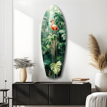Oval glass wall art depicting a coral flamingo among lush green tropical foliage, displayed above a black ribbed cabinet.
