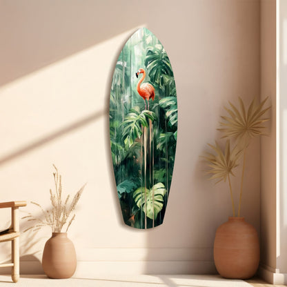 Oval glass wall art displaying a vibrant red flamingo amid lush green tropical foliage, displayed on a beige wall with ceramic vases.