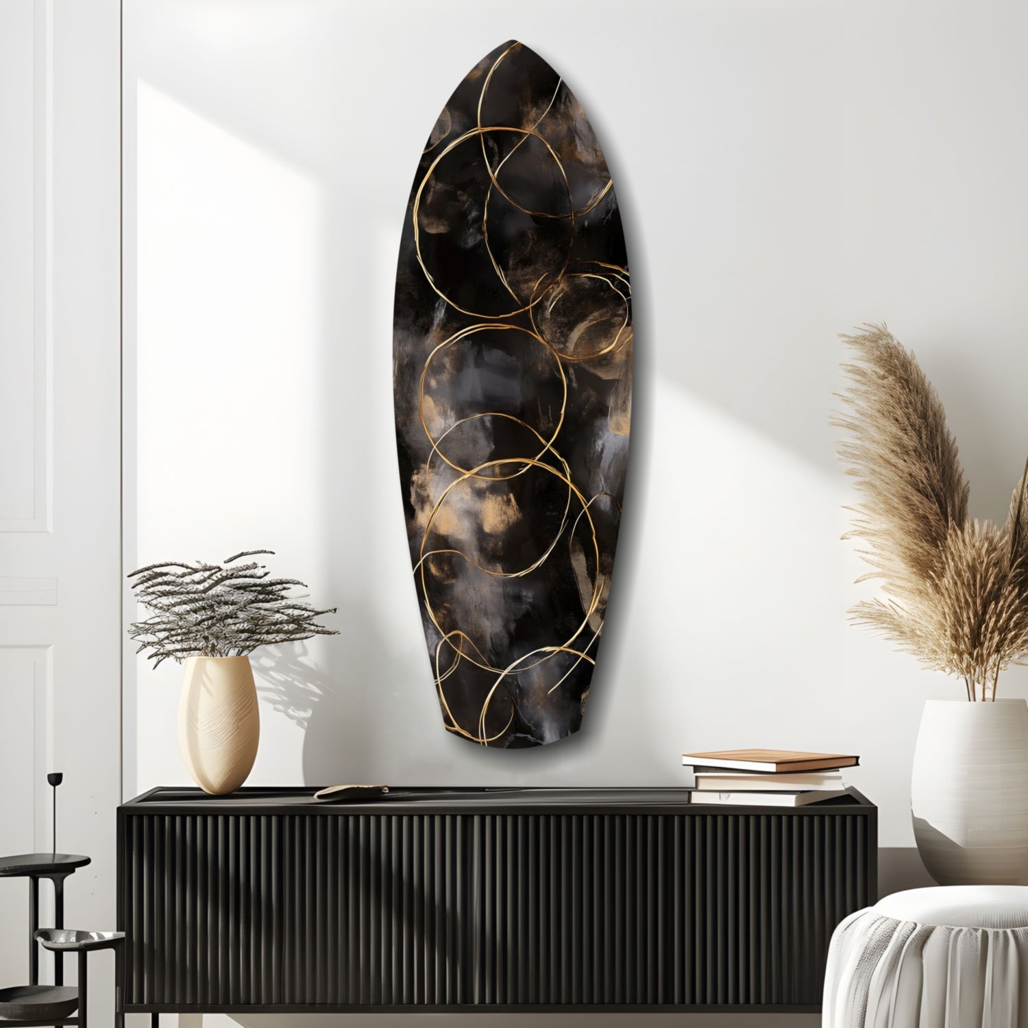 Black textured glass oval wall art with gold circular line designs, displayed above a ribbed black console table in a modern interior setting.