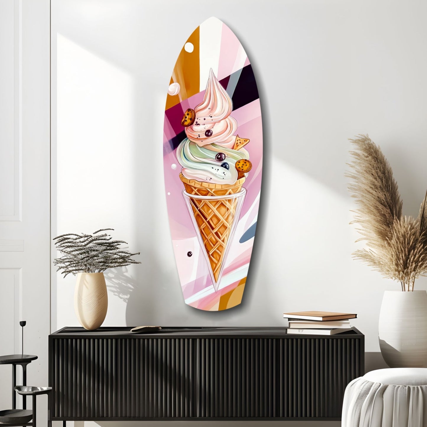 Oval glass wall art featuring a colorful ice cream cone illustration with pink, white, and golden tones, displayed above a black ribbed cabinet in a modern interior setting.