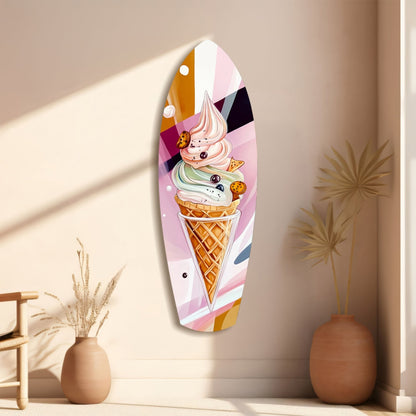 Oval glass wall art featuring a colorful stacked ice cream cone with cookie pieces, displayed on a beige wall beside decorative vases.