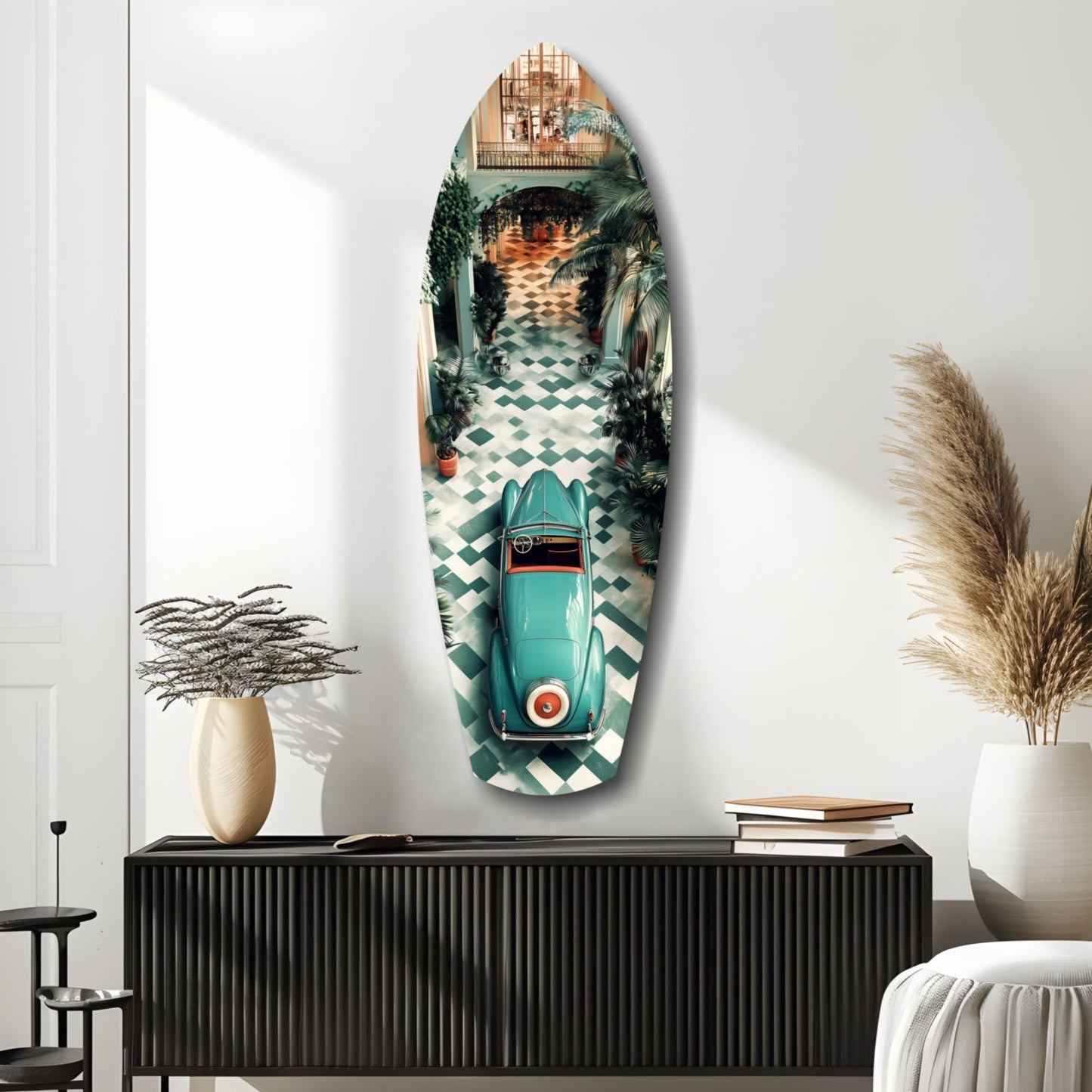 Turquoise vintage car displayed on oval glass wall art above black dresser in minimalist interior setting.