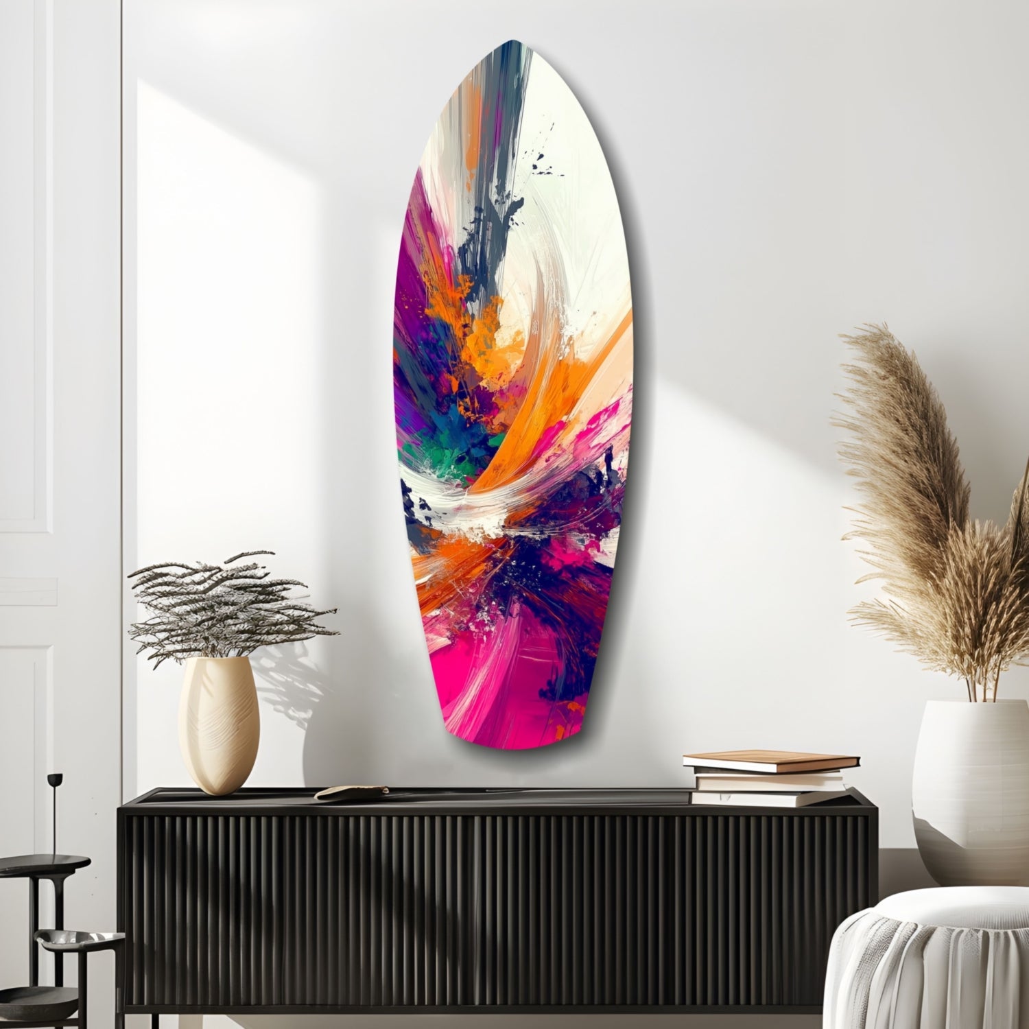 Vibrant abstract glass wall art with multicolored paint streaks in magenta, orange, navy, and white displayed above black cabinet in modern interior.