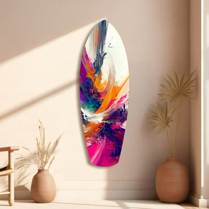 Elongated oval glass wall art with vibrant abstract paint strokes in magenta, orange, navy, and white, displayed on beige wall with dried grasses in ceramic vases.