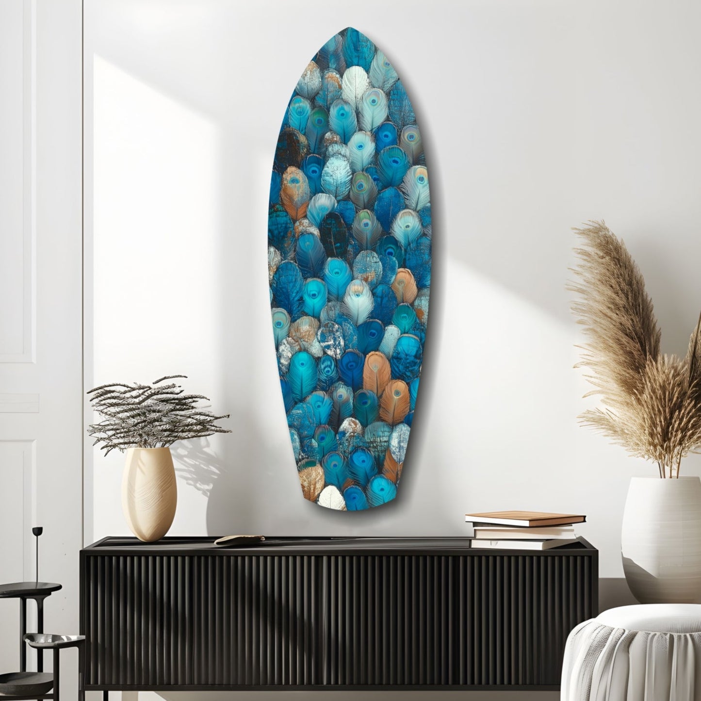 Oval glass wall art featuring blue, teal, and bronze feather patterns displayed above a black ribbed credenza in a minimalist interior.