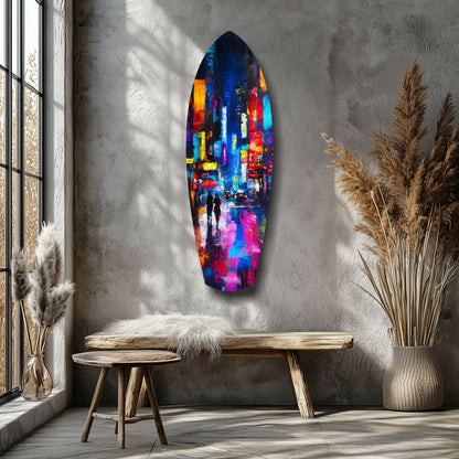 Colorful abstract glass wall art depicting a rainy cityscape hangs above a wooden bench in a minimalist interior with pampas grass.