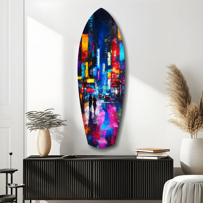 Vibrant oval glass wall art depicting a colorful rainy city street scene displayed above a black ribbed console table in a minimalist interior.