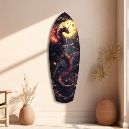 Oval glass wall art depicting a glowing dragon against a dark sky, displayed on a cream wall beside dried flower arrangements.