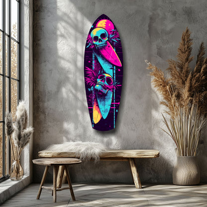 Neon skull surfboard glass wall art hung above wooden bench in minimalist room with pampas grass.