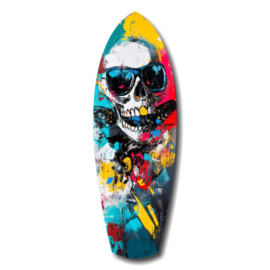 Colorful surfboard artwork featuring a skull wearing sunglasses surrounded by vibrant paint splatters in teal, yellow, pink, and red.
