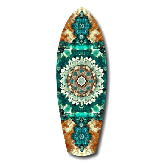 Surfboard-shaped glass art featuring symmetrical mandala design with teal flowers, white petals, brown center, and orange tie-dye borders on white background.