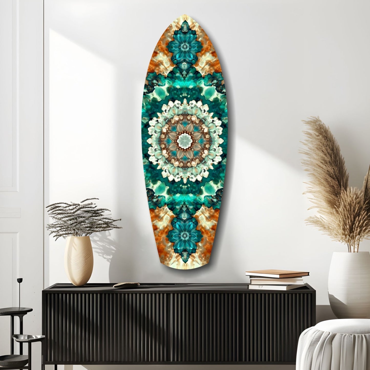 Oval glass wall art featuring teal, orange, and cream symmetrical mandala pattern displayed above black console table in minimalist room setting.