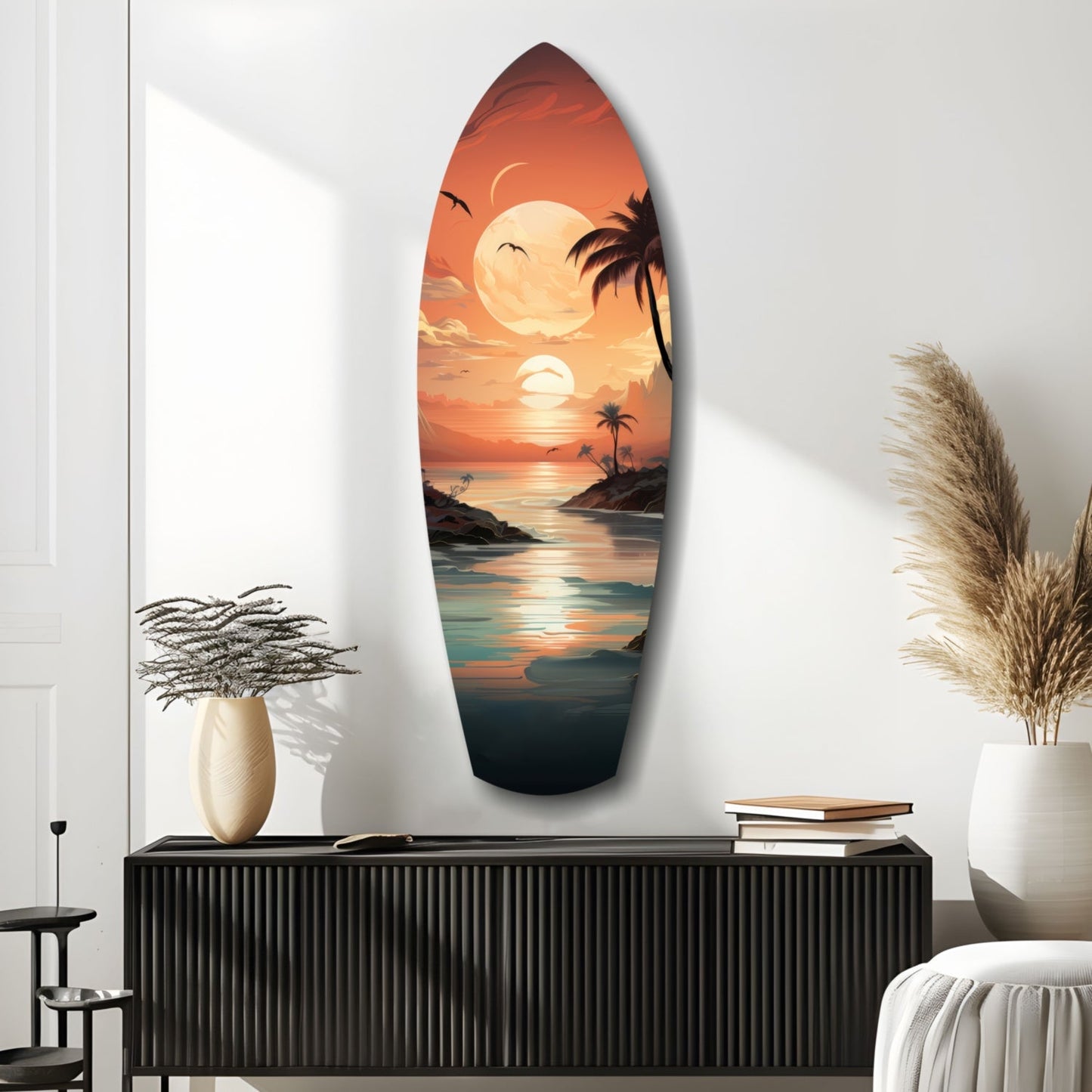 Surfboard-shaped glass wall art displaying a tropical sunset scene with palm trees, moon, and ocean, mounted above a black ribbed cabinet in a minimalist room.