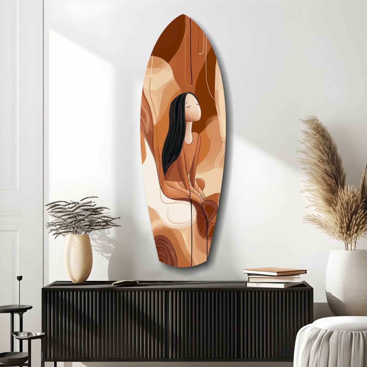 Oval glass wall art depicting a woman with long black hair in warm earth tones, displayed above a black ribbed cabinet in a minimalist interior.