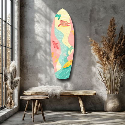 Colorful surfboard-shaped wall art with sea turtles and fish displayed above a wooden bench in a minimalist interior.