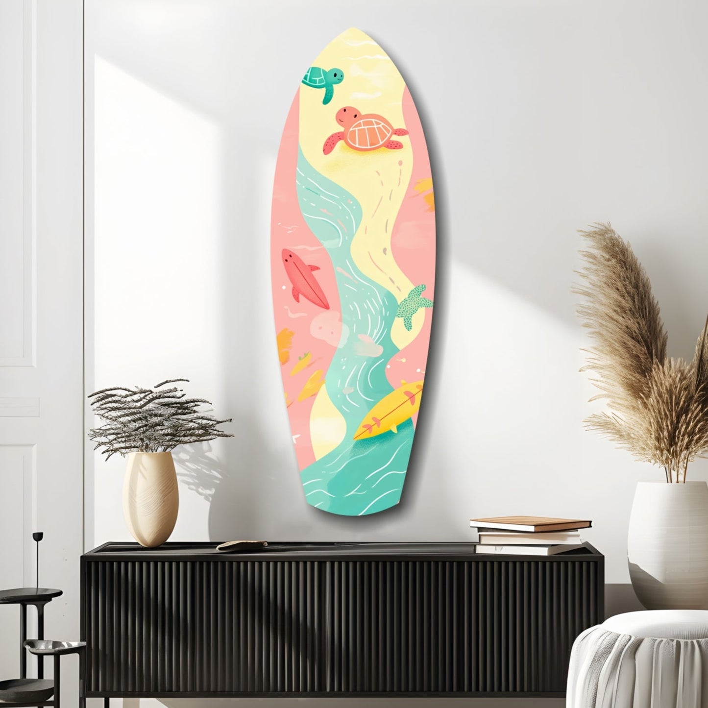 Surfboard-shaped wall art with colorful sea turtles, waves, and beach scenes in yellow, pink, and turquoise, displayed above a black cabinet in a minimalist bedroom.