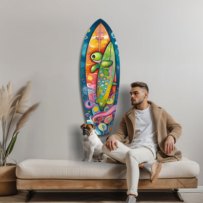 Man and dog seated on bench beneath vibrant multicolored surfboard-shaped glass wall art featuring stylized fish and ocean motifs.