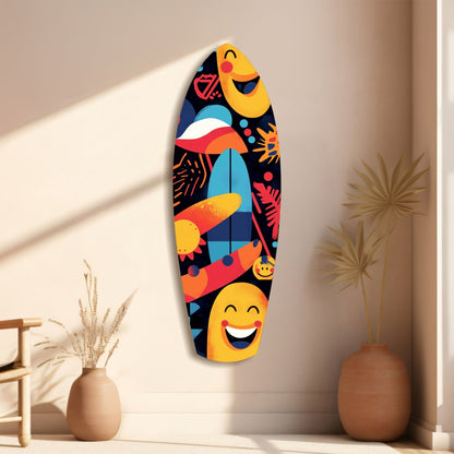 Colorful surfboard-shaped glass wall art with smiling faces and tropical patterns displayed on beige wall beside decorative vases.