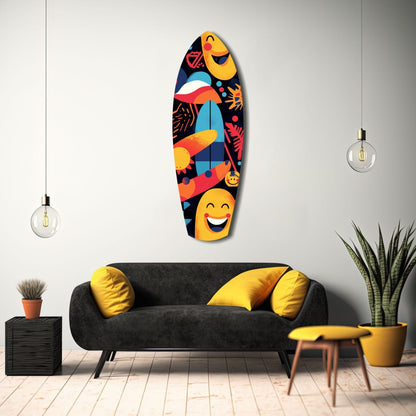 Colorful glass surfboard wall art with smiling faces and tropical designs displayed above a black sofa in a modern living room setting.