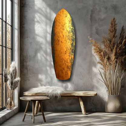 Golden textured glass wall art hanging above wooden bench in minimalist room with pampas grass and natural light.