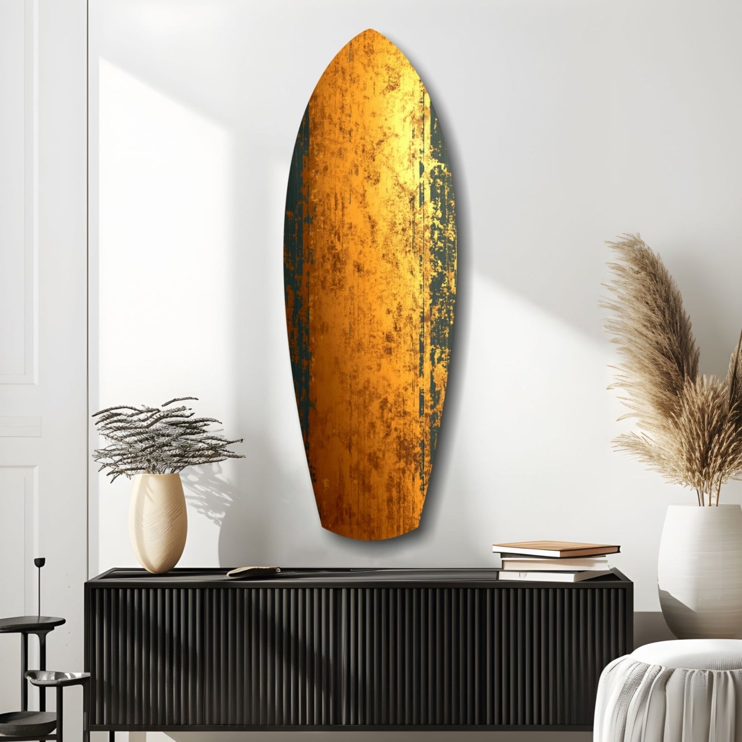 Oval golden glass wall art with weathered texture displayed above black cabinet in minimalist room setting.