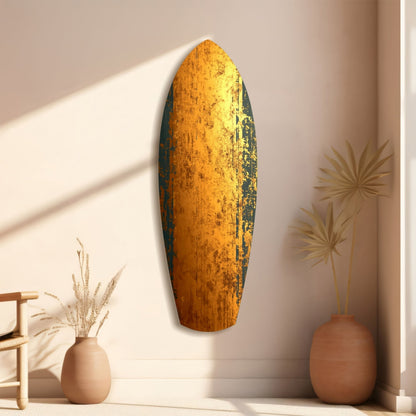 Golden Plate Glass Wall Art displayed vertically on beige wall beside terracotta vases with dried grasses, sunlight casting shadows.