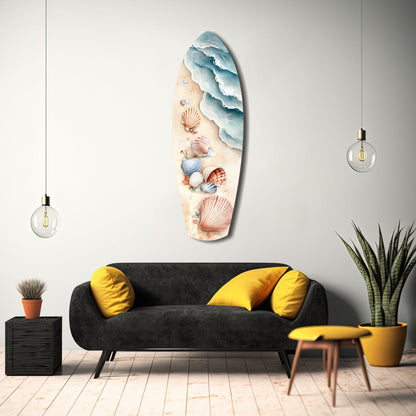 Shoreline Treasures glass wall art displayed above a black sofa with yellow pillows in a modern living room interior.