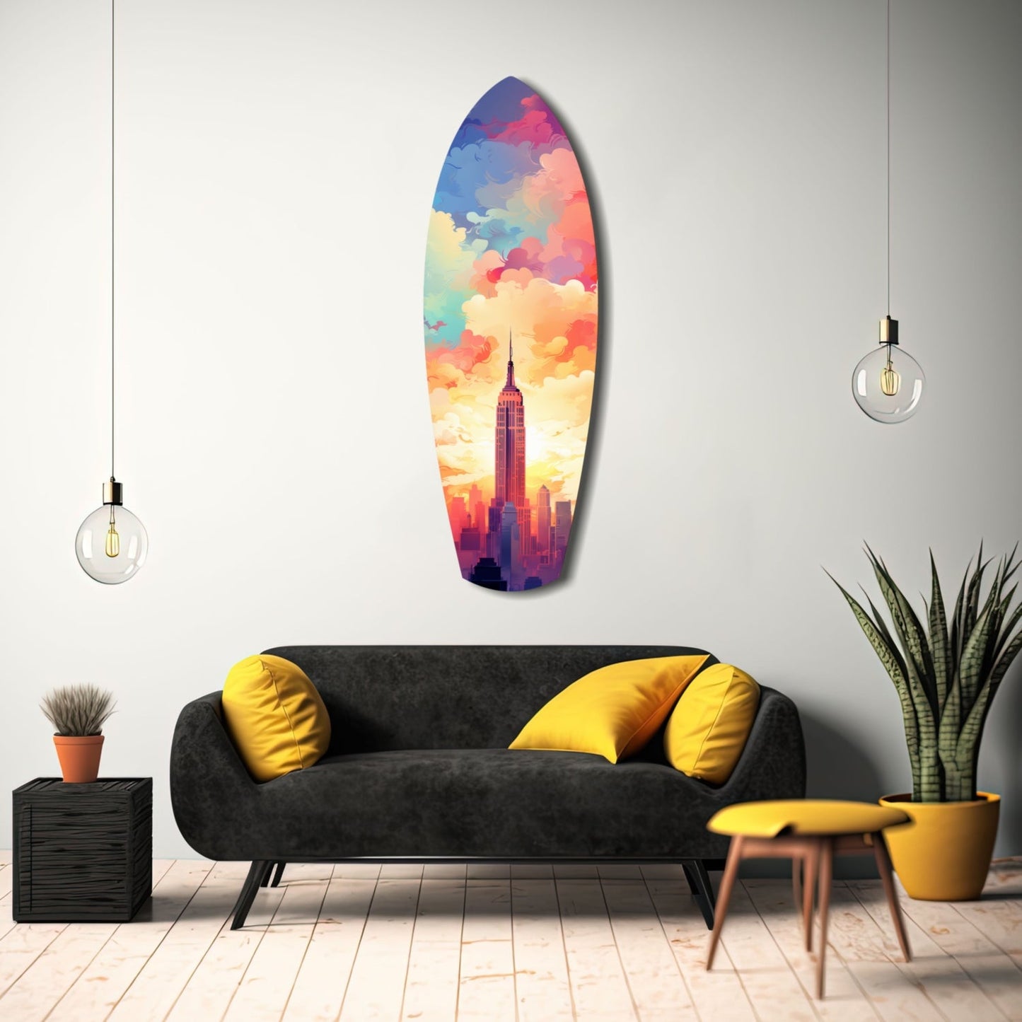 Colorful surfboard-shaped glass wall art depicting Empire State Building at sunset, displayed above black sofa with yellow pillows in modern living room.